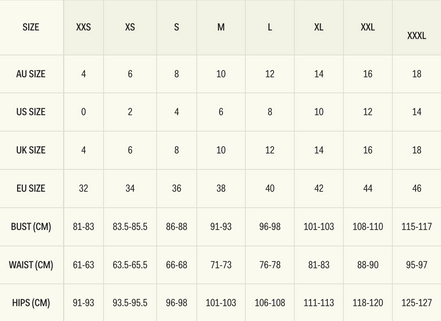 Robe midi Marguerite en satin à pois noirs et blancs, dos nu et bretelles.